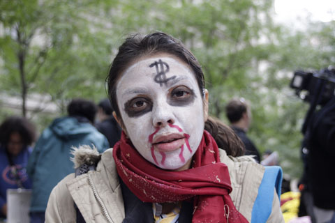 Occupy Wall Street protester in zombie costume
